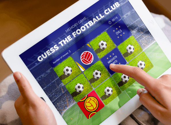 A man is playing memorial on a tablet